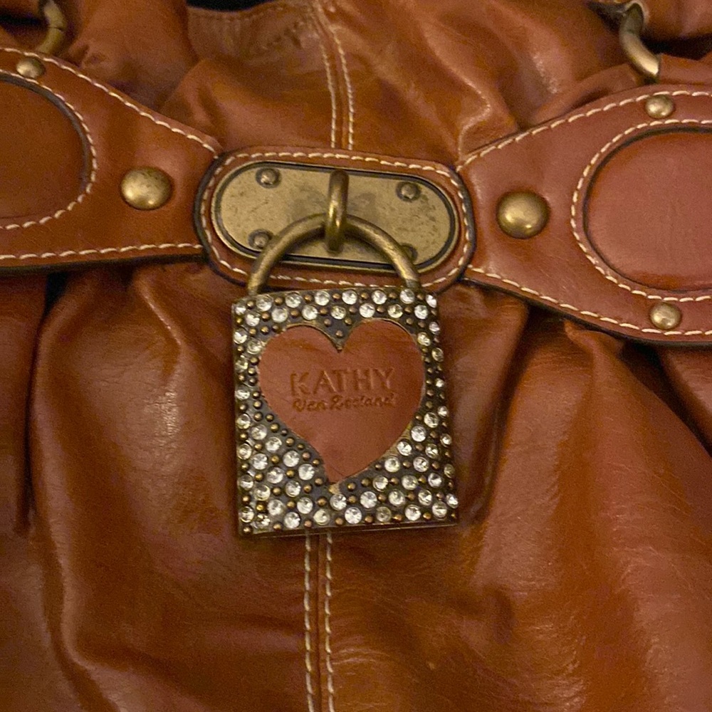 Kathy Van Zeeland heart lock purse so cute with bling